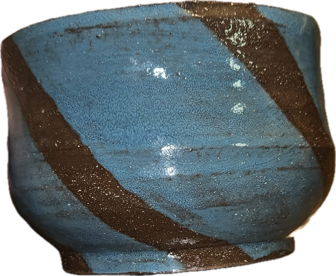 A brown ceramic bowl with thick light blue stripes